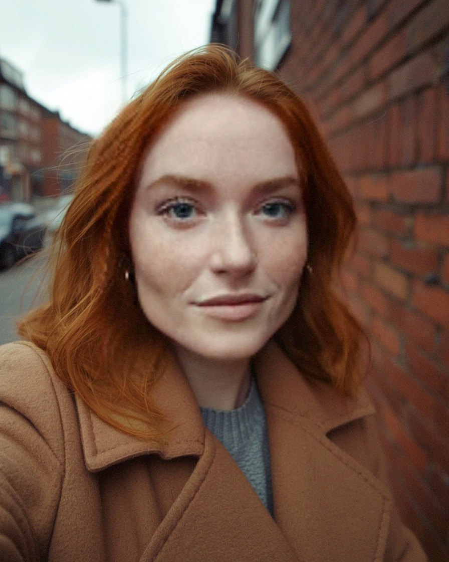 Fia Quinn on a Manchester street in a camel coat